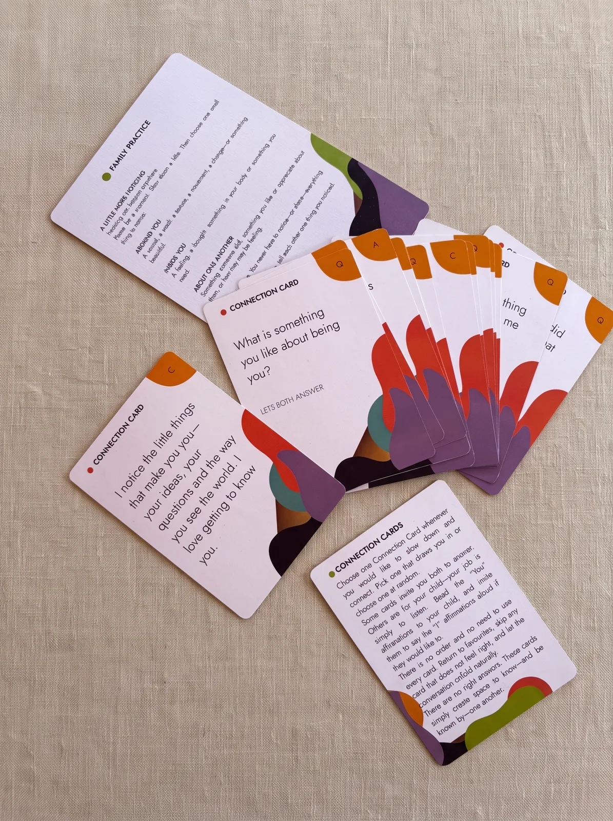 NOTICING Connection Cards fanned out on linen